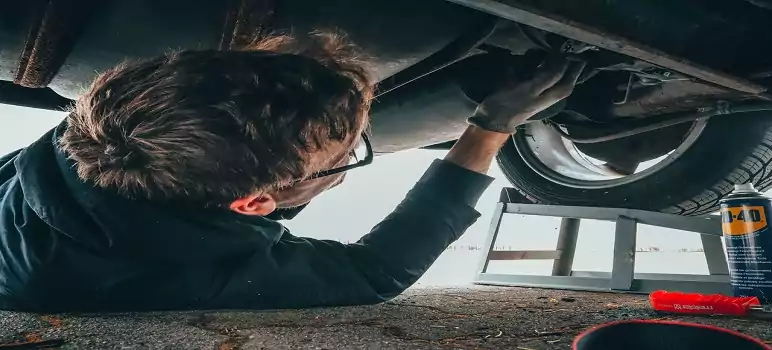 a-professional-car-mechanic-is-repairing-exhaust-pipe-of-the-car-how-to-become-car-mechanic